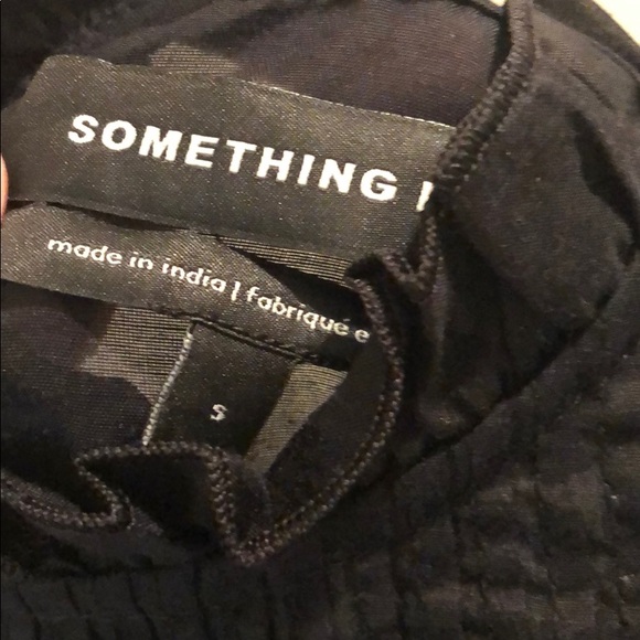 something navy pleated peplum top